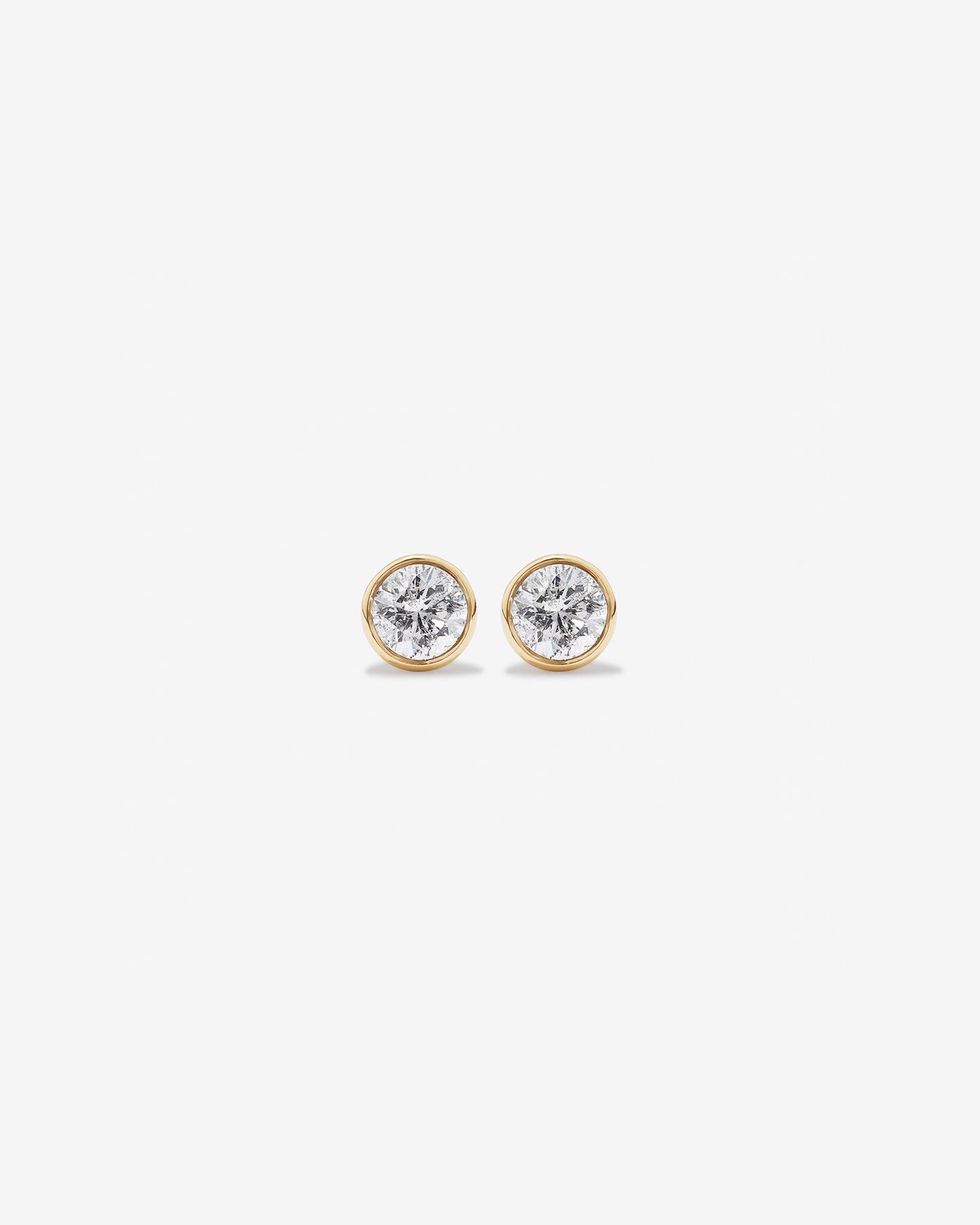 0.25 Carat TW Round Brilliant Diamond Solitaire Bezel Set Stud Earrings in 18kt Yellow Gold